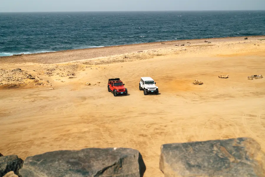 Two Jeeps on the sand on Aruba's north coast