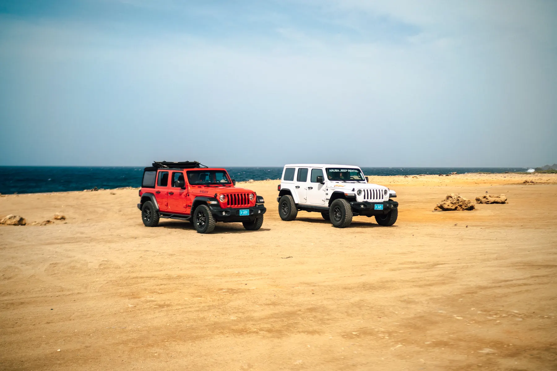 EFE Jeep Wranglers parked on the sand by the sea on Aruba's north coast